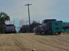 Localizan cuerpo con un impacto en la cabeza en parcela de Maneadero