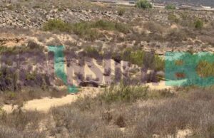 Localizan cuerpo en un hoyo en medio del arroyo en San Quintín